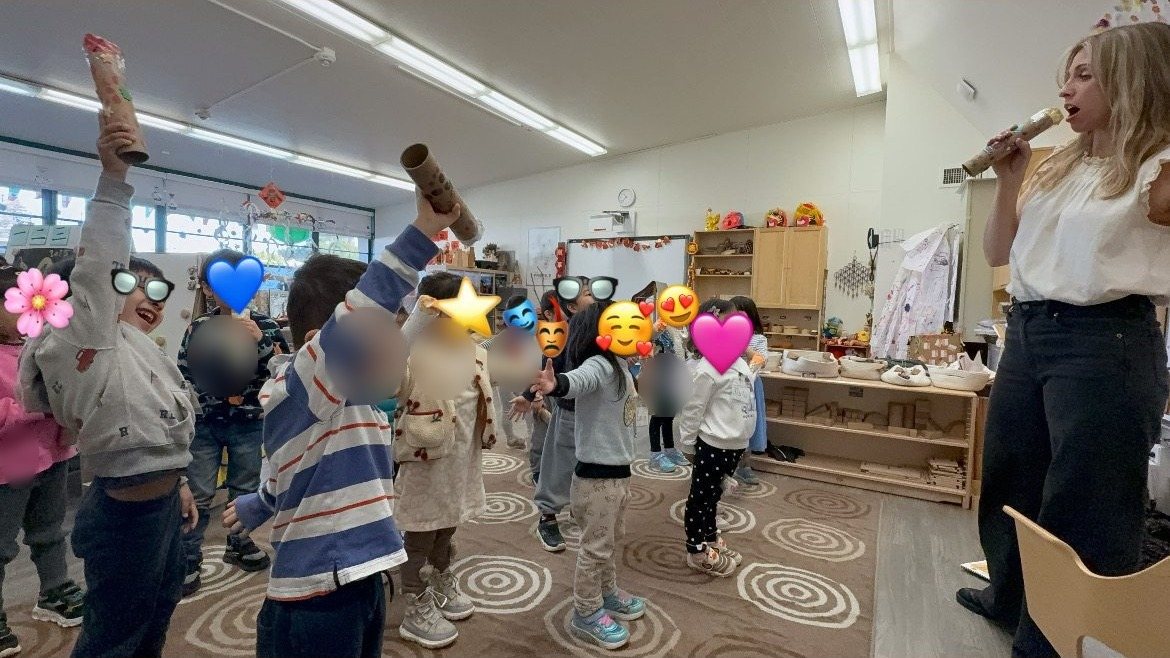 Erin leading a music class with young students